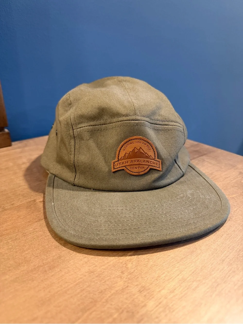 The Classic Olive Green Canvas Five-Panel Hat with Brown Patch
